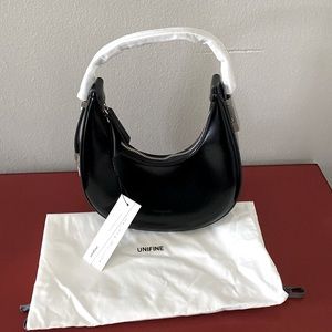 Black leather crescent shape bag